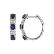 CE97504BS4X3. 14K Solid White Gold Blue Sapphire Oval Hoops